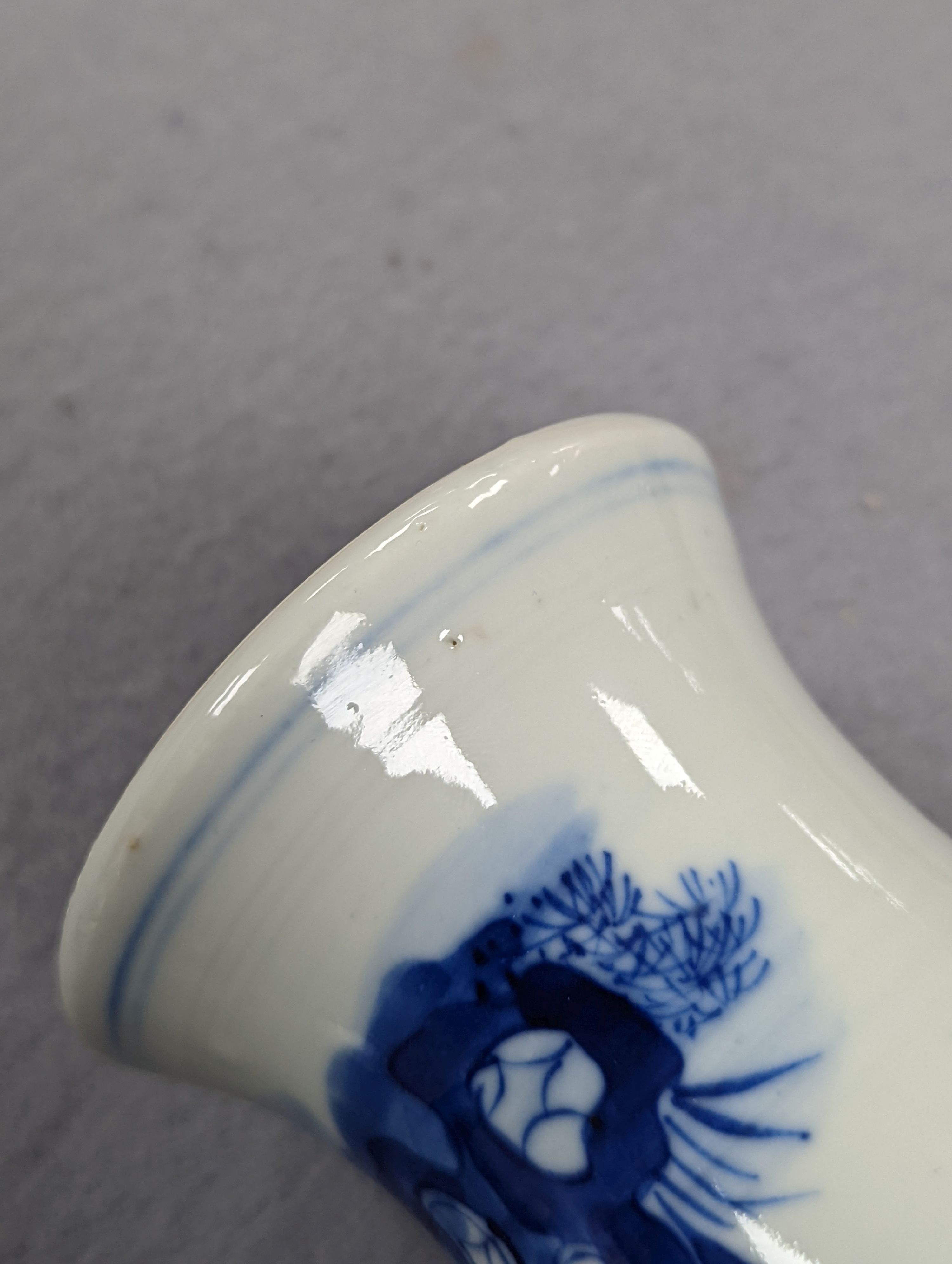 A late 19th century Chinese blue and white baluster vase, painted with birds amid flowers and rock work, pseudo Kangxi mark. 26cm